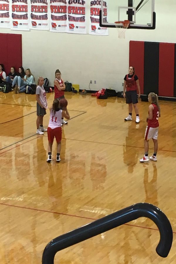 The girls practicing their free throws on day two of practice.