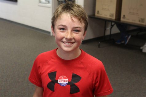 Middle School student Chase Grove getting his vote on