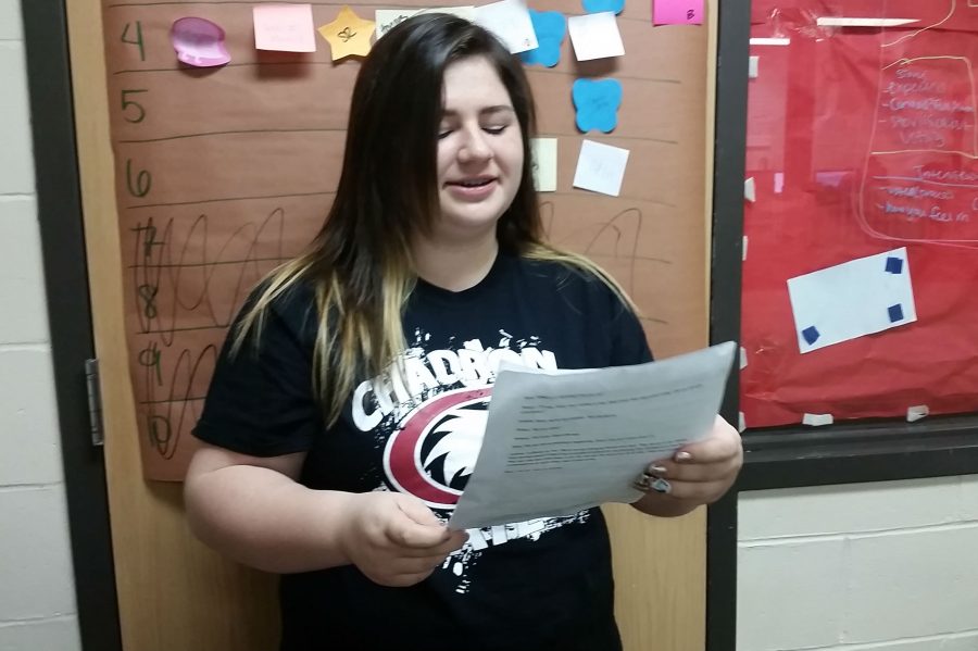 Loren Ritter, a member of Readers Theater and Musical theater, practices her script. 