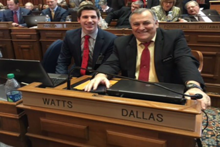 Carter Nordman (left) sits next to Representative Ralph Watts (right). Nordman serves as clerk under Rep. Watts during the spring semester and spends his time working at the Iowa capitol.