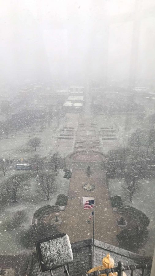 View of a snow storm at the top of the Iowa Capitol 