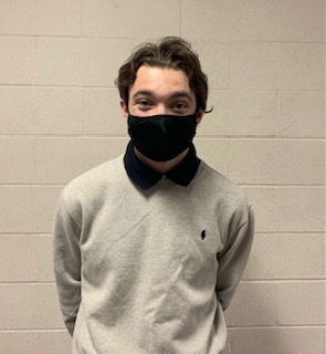 The Student of the Month for November, Cash Riker smiling under his mask, excited to be honored with Student of the Month. 