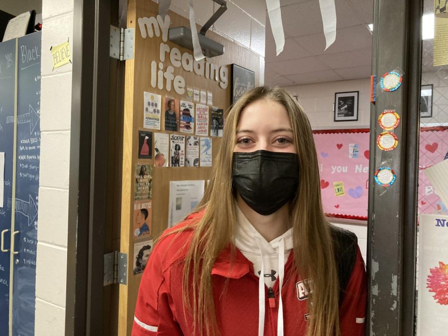 Beaming behind her mask, senior Aniston Smith stays during her open to complete her interview. She has been honored as one of the Kiwanis Students of the Month, which she believed is due to her applying herself more in school and activities. 