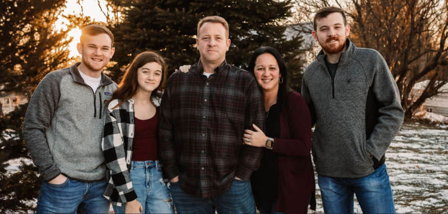 Mrs. Reed and her family posing for a family picture. If you need professional, high quality pictures look at more of her work on her website and follow her on Facebook @JRPhotography. 