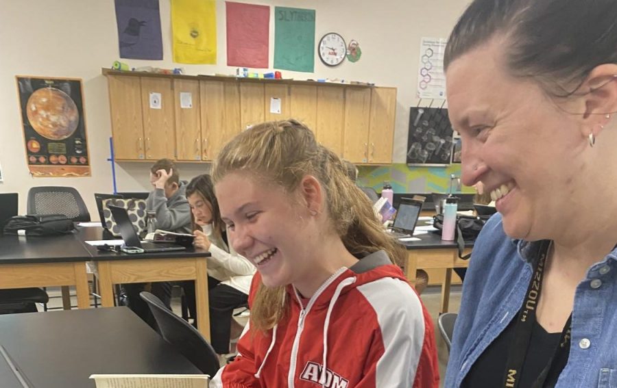October’s Teacher of the Month: Mrs. Knipper helping a student in her Science-English class