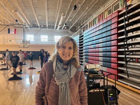 Mary Beth Scott- February Teacher of the Month, during a 9th/10th PE class where the students were participating in a step box workout.