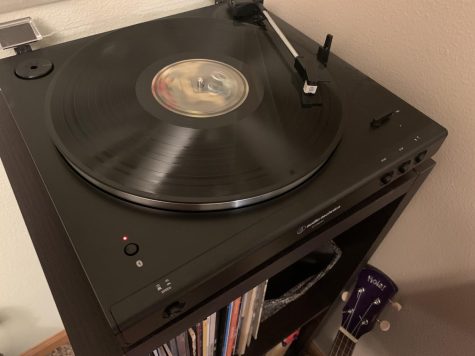 A turntable spins a record. 