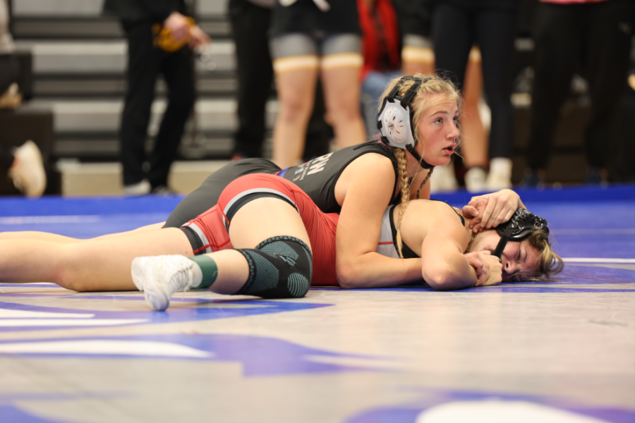 Kealin Sutton attempting to pin her opponent. 