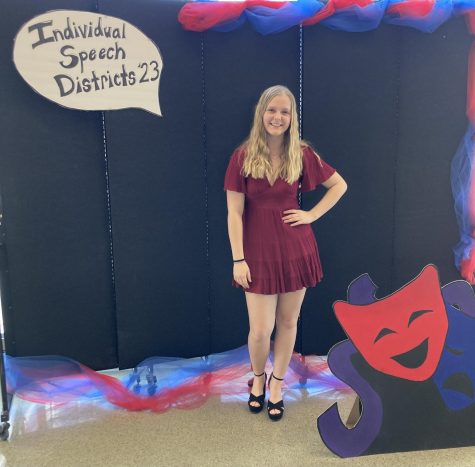 Posing by the Speech Districts sign, state qualifer Payton Taylor celebrates her acheivments. 