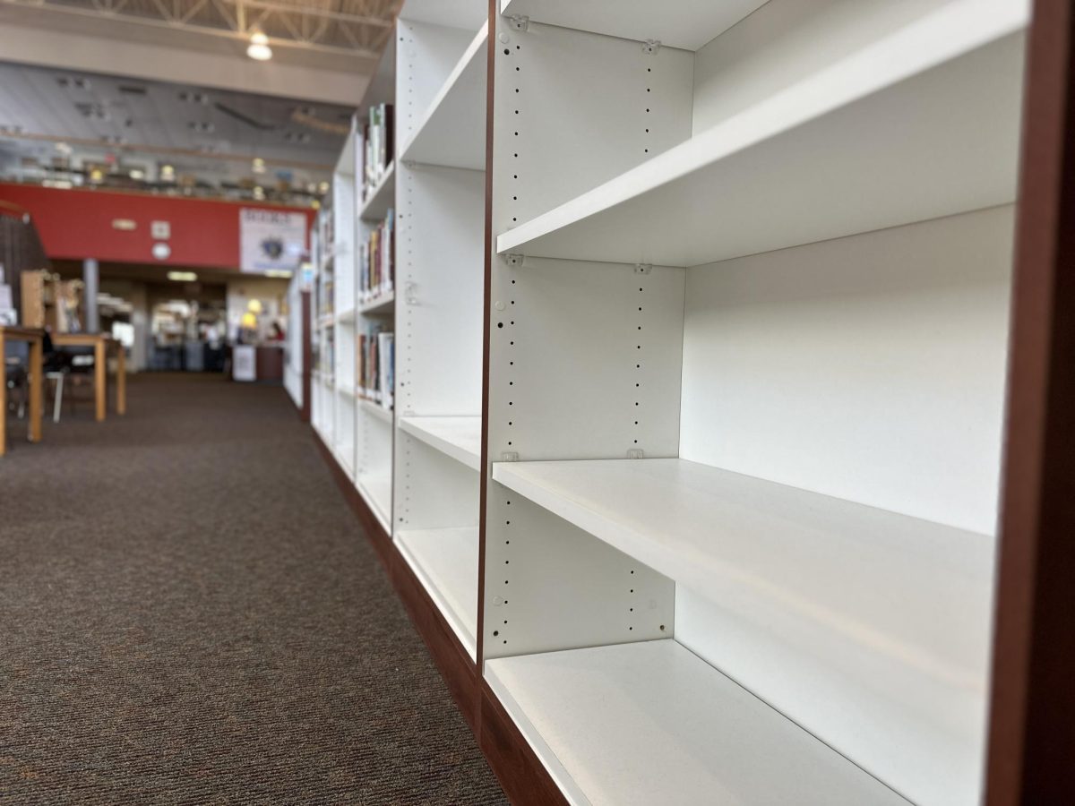Empty shelves litter the library as the process of removing banned books continues.
