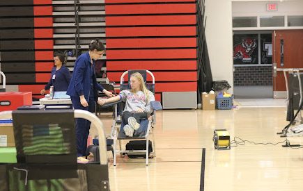 LifeBlood nurse draws blood from Sophmore Hailey Nelson during the ADM Blood Drive. Photo taken by Anthony Pawlosky