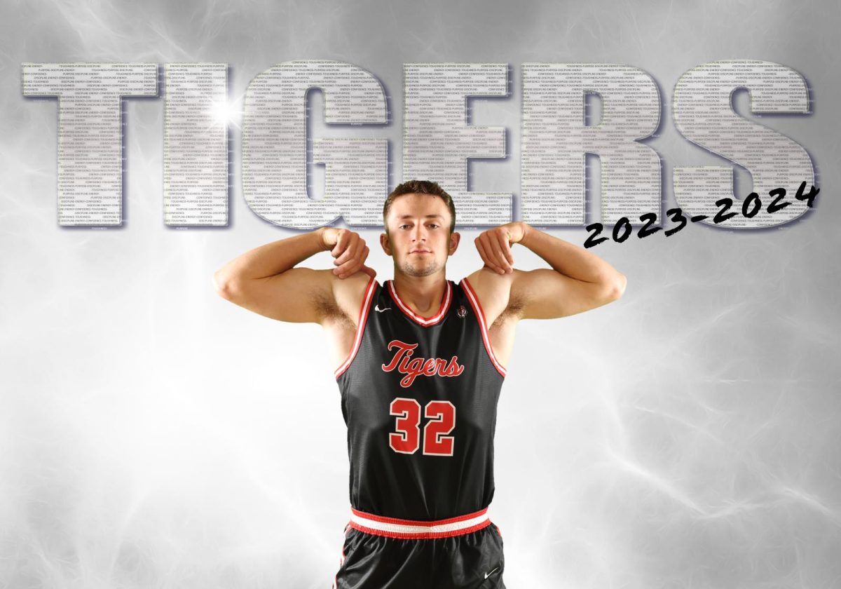 Grant Rychnovsky poses for his ADM Boys basketball poster picture
