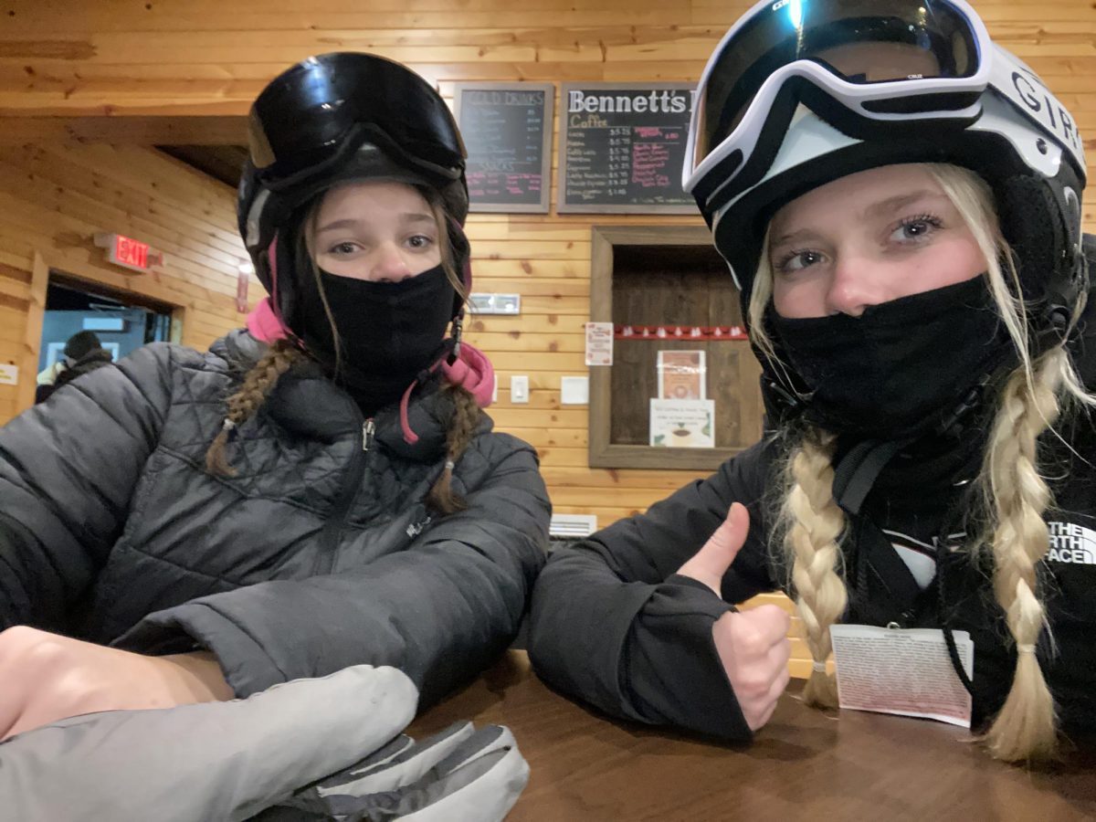 Mallory and Katy warming up inside the lodge at Seven Oaks after snowboarding in the below freezing temperatures. Make sure to wear many layers when you are snowboarding so you can keep your muscles warm to prevent injuries. 
