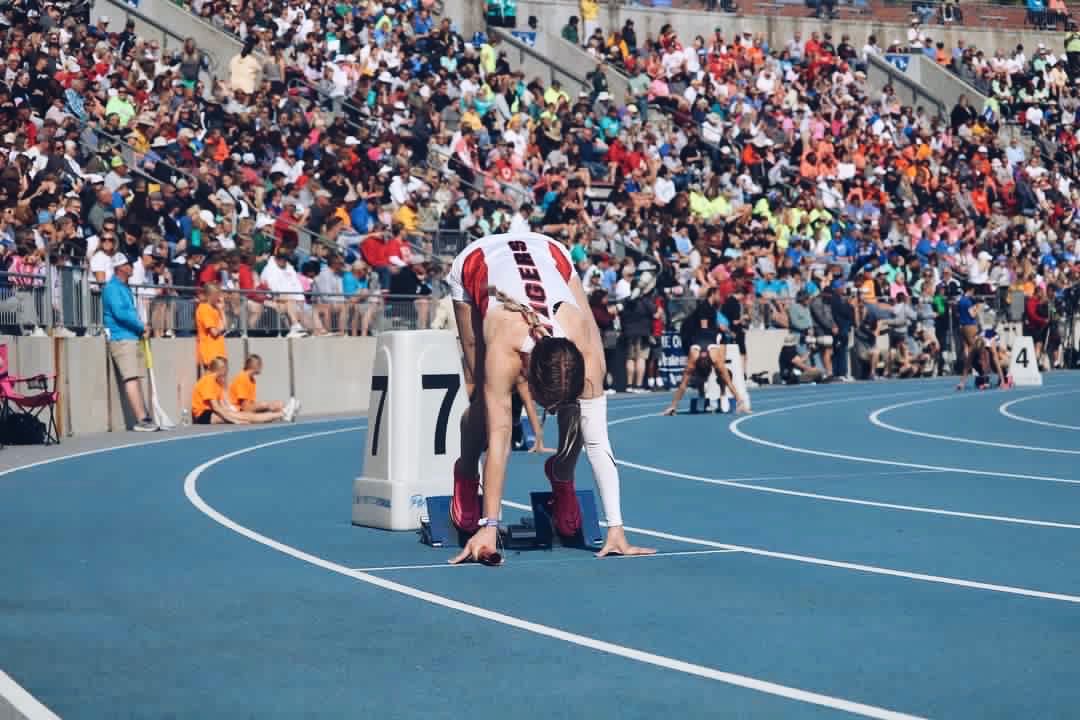 Calli Seehase entering into the blocks before running in the Iowa High School Girls State track meet. 