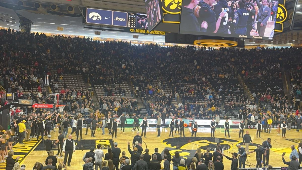 The Iowa Mens basketball team celebrates after knocking off Wisconsin in overtime 88-86 at Carver Hawkeye Arena on February 17, 2024. Adam Bryte said that he expects Iowa to be able to compete because they will be able to shoot really well next year.