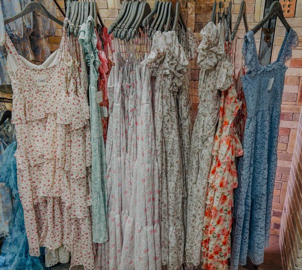 Colorful and floral dresses fill the walls of Altar’d State and many other stores at the mall. These dresses can range from about $60 to $200 and are about a fraction of the price of traditional prom dresses. 