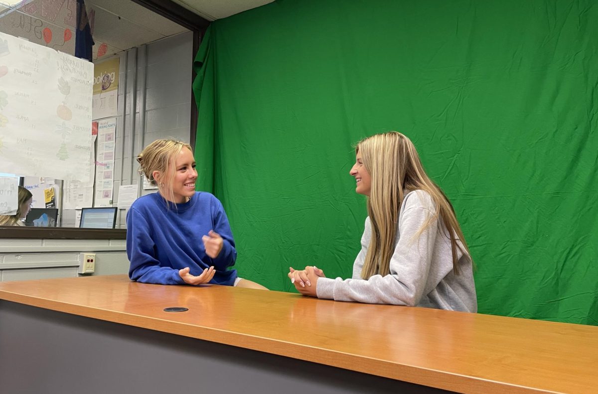 Laughing at a joke, Kate and Celie get ready to film a new episode of Lets Talk.