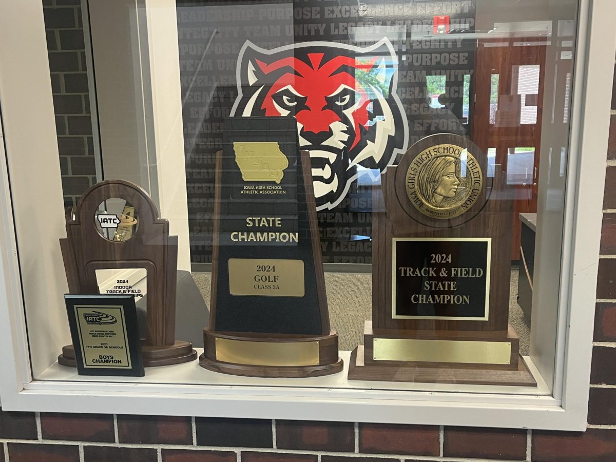 Sitting in the window of the ADs office, both state trophies are displayed.