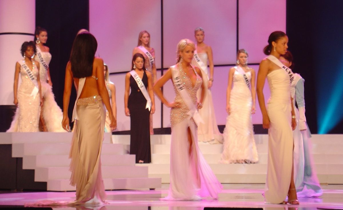 Miss USA participants line up on stage, ready for rehearsal.