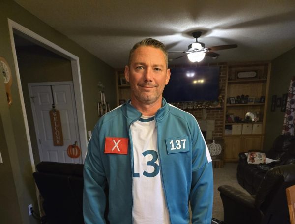 Wearing a recreation of the signature Squid Game tracksuit is Dan Garrity, Player 137.