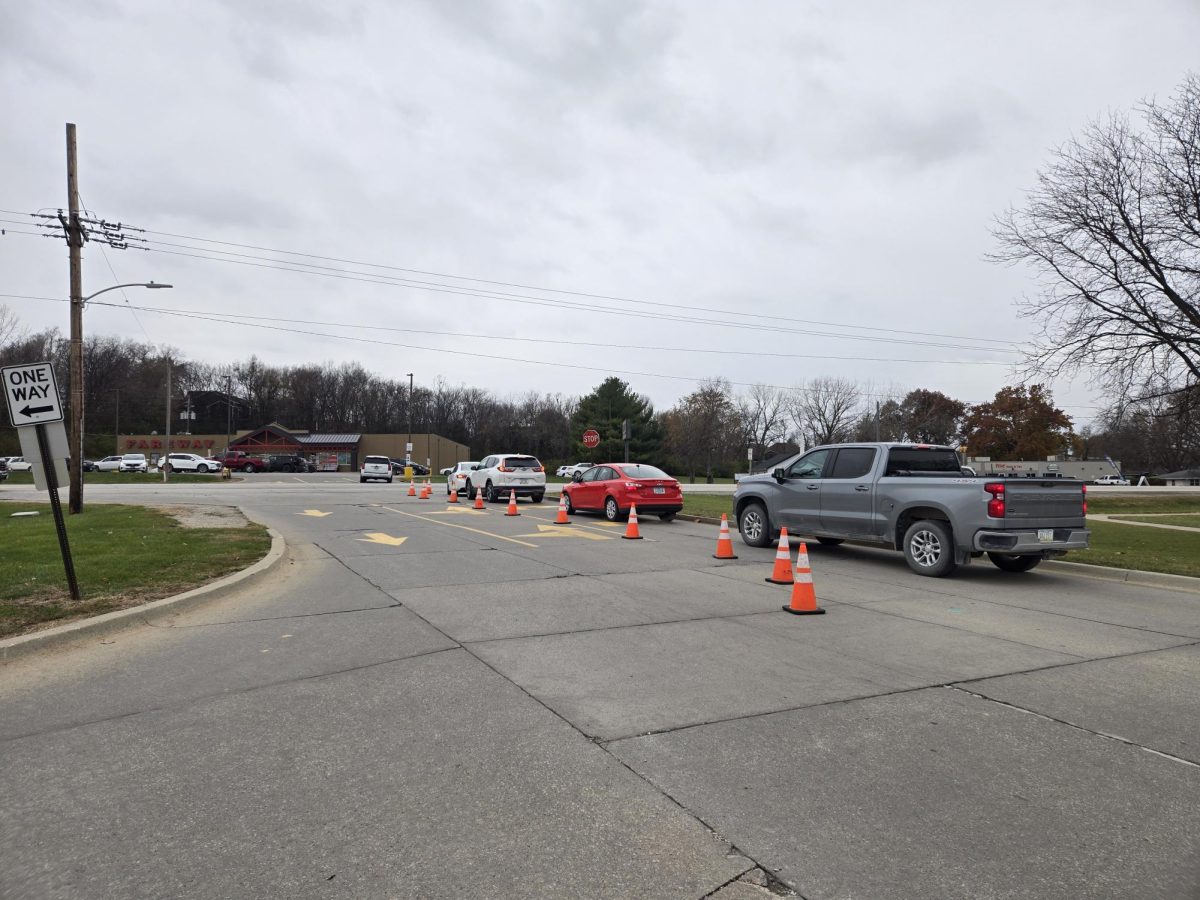 Leaving after a day of school, a string of four cars must turn right due to the present cones blocking left turns.