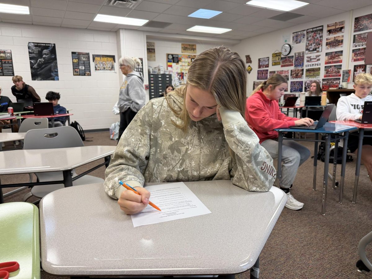 Student stressed during a test. she said she does preform superstitions under pressure.