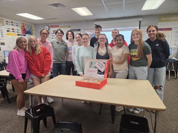 BlackandRedgister celebrates their qualification for News Team of the Year with donuts following the awards presentation.