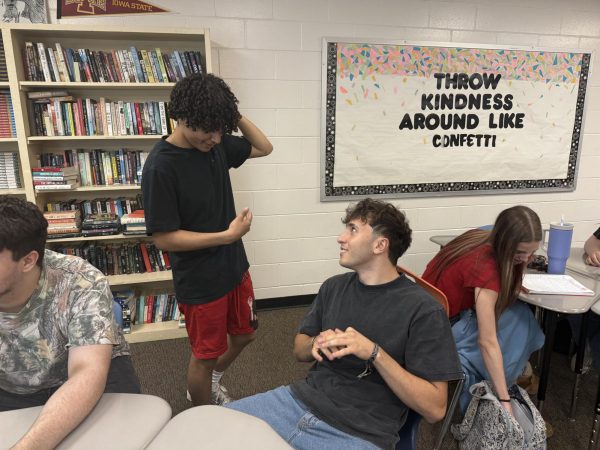 In Composition class, Mohammad Amro (left) converses with Mohammad Marwan Hajeh (right) in Arabic. 